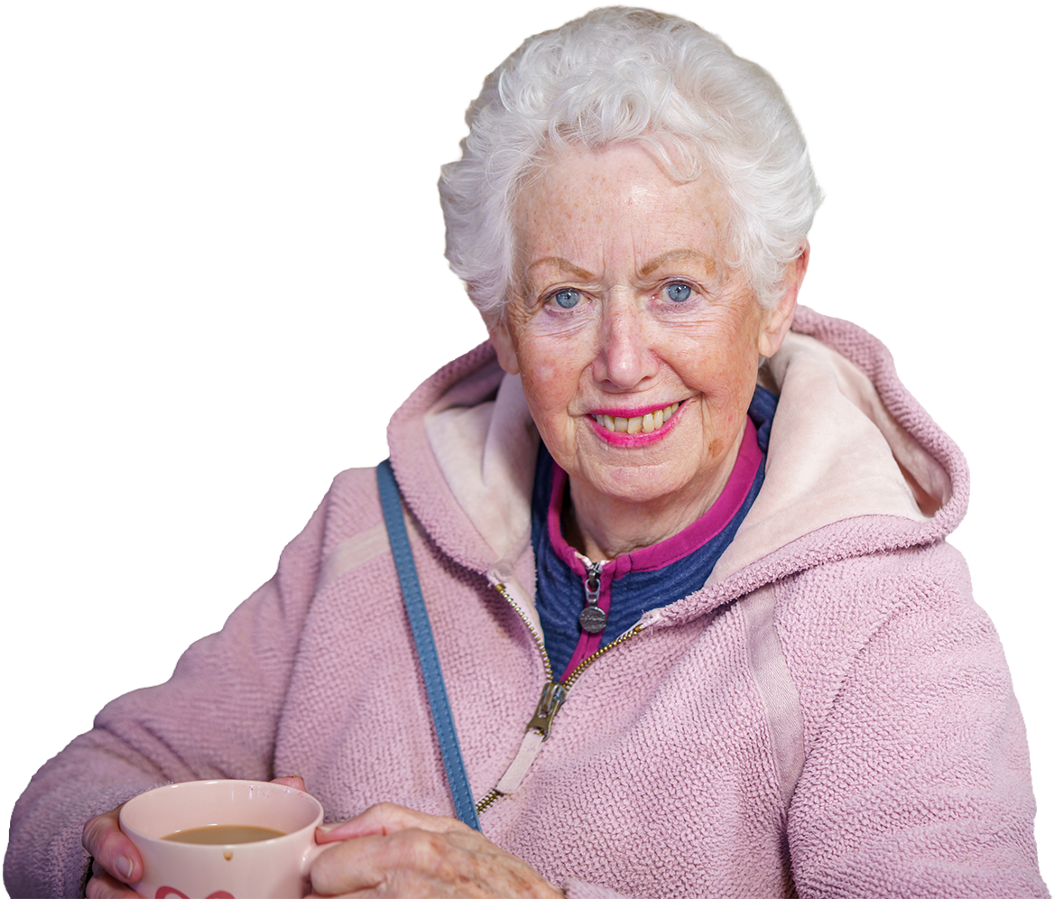 Lady with coffee An elderly lady sitting down drinking a coffee